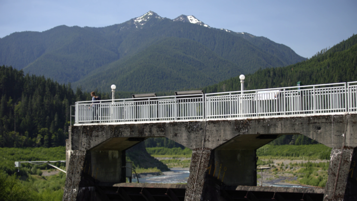 dam in the pacific northwest with mountain backdrop