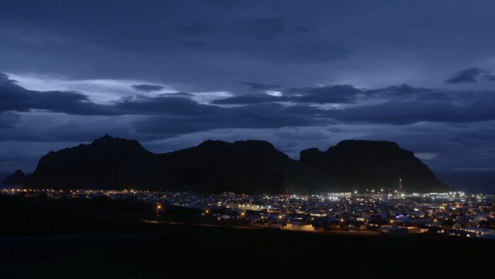 A town in Iceland lit up by artificial light.
